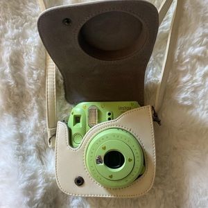 green instax mini 9 minimally used, comes with the case thing and some lenses